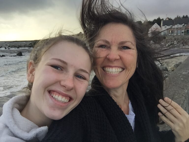 Daughter 4 and MaryPat, landing in Ireland with hair blowing, 2019